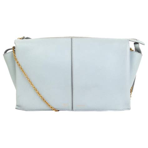 celine tri fold clutch on chain blue|Celine.